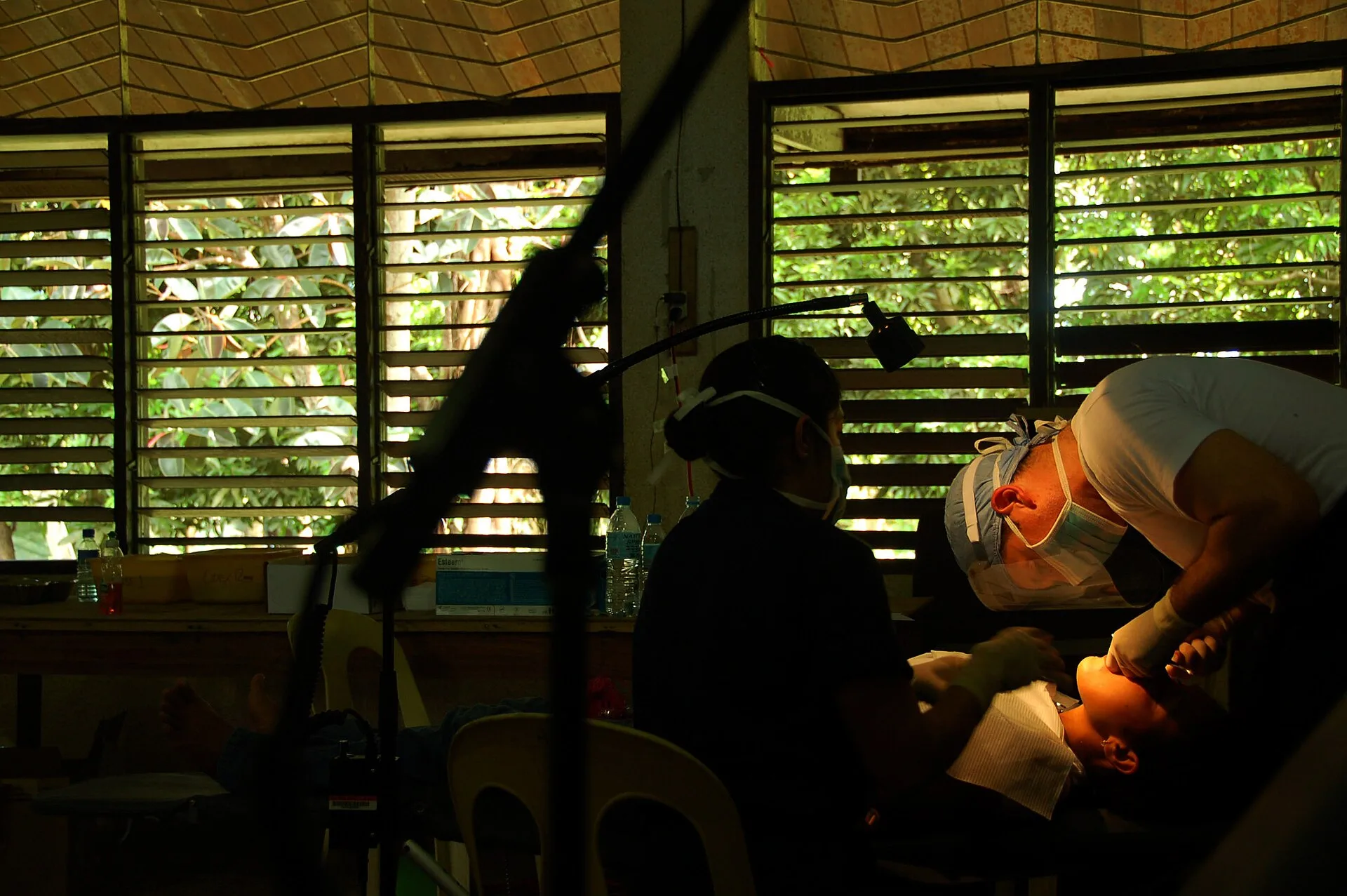 CALBAYOG CITY, Philippines (June 11, 2008) Lt. Cmdr. Ron Citro, a dentist embarked aboard the Military Sealift Command hospital ship USNS Mercy (T-AH 19), performs a tooth extraction on a patient in an improvised dental office. The Pacific Partnership medical team is in Calbayog City in Samar, Phili. Dental content marketing practices: answer first, define terms, label and test links