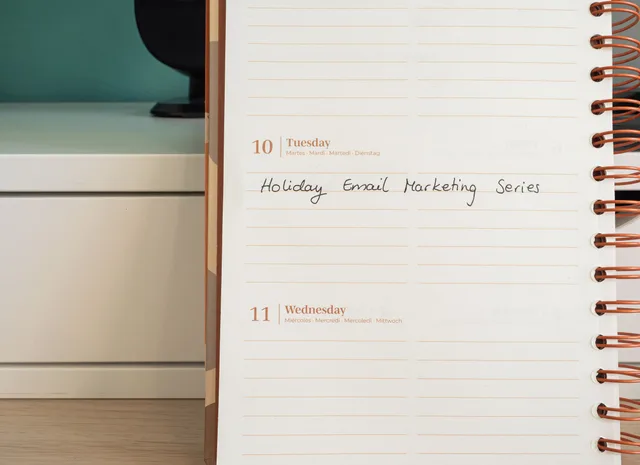 Planner open on a desk with handwritten 'Holiday Email Marketing Series' note. Dental email marketing checklist: sender and delivery checks