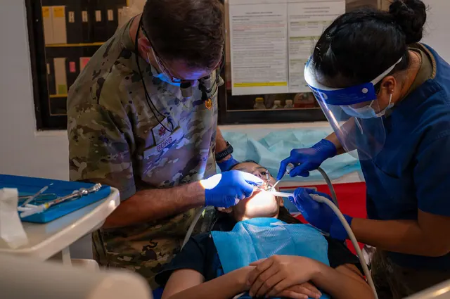 U.S. Air Force Maj. Lucas Borg, left, 15th Operational Medical Readiness Squadron dentist, and U.S. Air Force Tech. Sgt. Apryl-Len Cabase, right, 15th OMRS dental technician, provi. Dental social media: a focused business guide for 2027