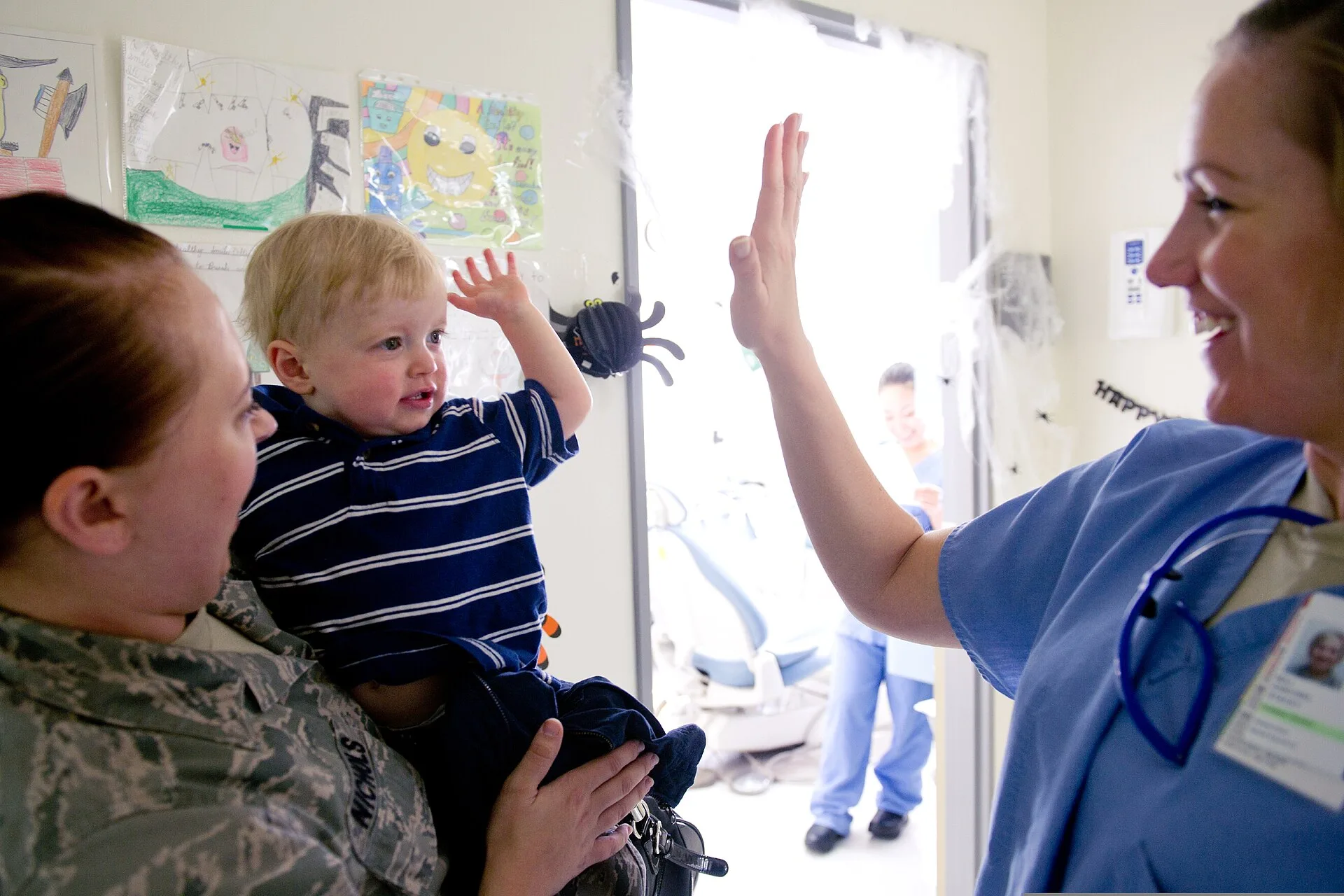 U.S. Air Force Maj. Stacey Zaikoski, right, a 374th Dental Squadron pediatric dentist, and a patient high-five after the boy completed his first dental appointment at the dental clinic at Yokota Air Base, Japan, Oct. 28, 2011. How to improve dental website marketing with task evidence