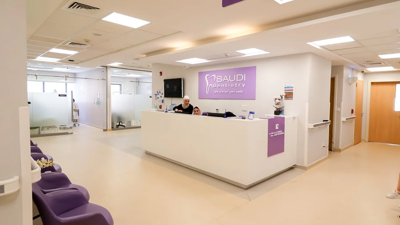 A reception desk and waiting area inside a dental clinic.